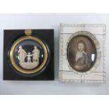 Miniature portrait painting in ivory style frame and a carving of the Holy Family in black frame