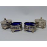 Four piece cruet set consisting of two lidded mustard pots and two salts,