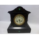 A 19th century French H Riondet black slate and malachite inlaid mantle clock of architectural form,