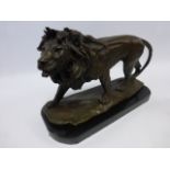 Cast Bronze after Barye - standing male lion on marble base, 38cm long, 27.5cm high.