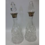 Pair of silver mounted cut glass mallet shaped decanters,