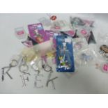 Sixty+ hair accessories together with various key rings and charms.