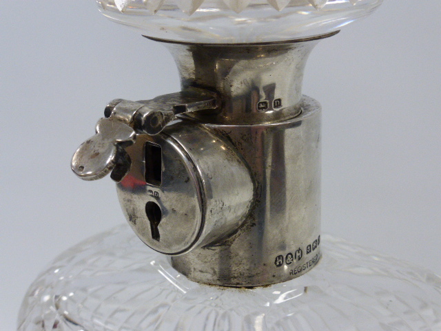 A silver-mounted lockable decanter, hallmarked Birmingham 1928, by Hukin and Heath, - Image 2 of 4