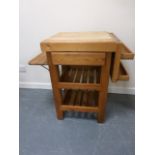 A pine Butchers block with shelves and single drawer, 67x47x83cms.