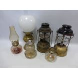 Two Tilly lamps together with other oil lamps.