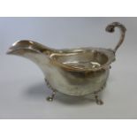 Edwardian silver sauce boat of typical form with gadrooned rim, hallmarked London 1906,