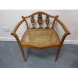 Sheraton revival satinwood serpentine fronted cane seated chair with painted portrait splats with