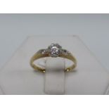 18ct gold and platinum Diamond solitaire ring set with diamond set shoulders, size L/M.