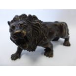 Bronze sculpture of a roaring lion 15.5cm long.