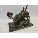 Cast Bronze after Milo of a Moose on rocky ground with tree stumps, on rectangular marble base,