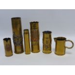 Trench Art - four shell case vases Arras, Reims etc, small jug and shell case.