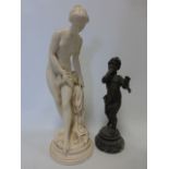 Spelter figure of a semi-clad girl on circular marble base 29cm high,