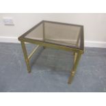 Heavy brass occasional table with smoked glass top, 46x46x41cms.