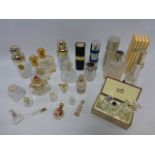 Collection of used perfume bottles.