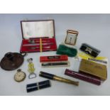 An eclectic mix of items including a Swan fountain pen with 14ct gold nib,