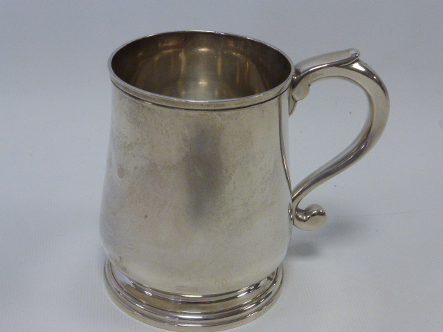 Silver tankard / christening cup hallmarked London 1964 by maker Richard Comyns, 9.