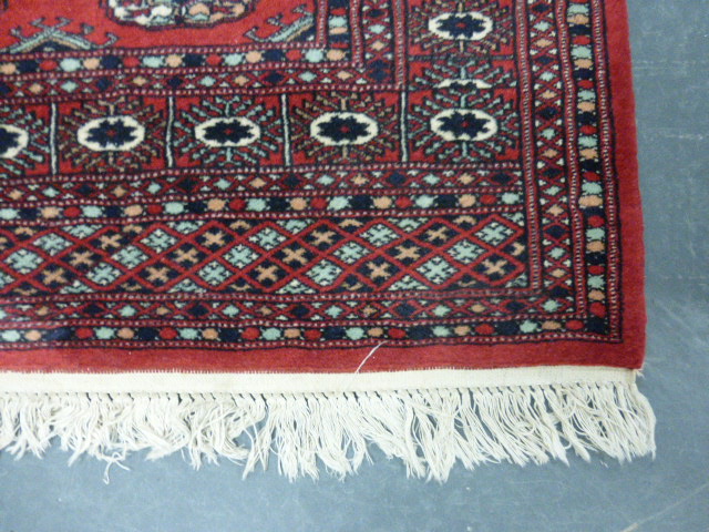 Iranian rug with two rows of twelve guls, 150x96cms. - Image 2 of 3