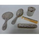 Silver backed mirror and brush set embossed with winged cherubs/angels hallmarked Birmingham
