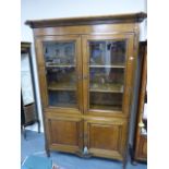 Fine French René Trotel display cabinet / bookcase with shaped moulded cornice above twin glazed