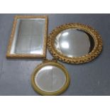 Three giltwood framed wall mirrors including a circular convex mirror 52cms in diameter.