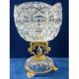 An impressive cut crystal centrepiece bowl on gilt metal supports in the form of mythical creatures