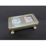 Edwardian silver double stamp case with hanged lid, on ball supports,