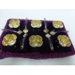 Set of six Victorian silver salts and spoons, of quatrefoil form with gilt washed bowls,