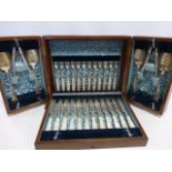 Cased set of silver flatware consisting of 12 knives and forks with engraved blades and mop handles,