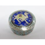 Continental silver trinket pot with enamelled Camal decoration, stamped 999, 4.8cms in diameter, 29.