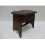 Small oak stool of rectangular form, the hinged top with canted corners.