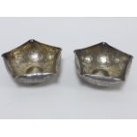Pair of white metal bowls of pentagonal form with gilt wash interiors and chased foliate engraving,