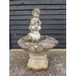 A garden bird bath with a Faun playing pan pipes atop, 75cms in height.