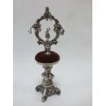 Early 20thC novelty pin cushion/ring stand probably silver, but unmarked,