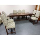 Splendid quality hand crafted Oak dining table and eight (6+2 carvers)upholstered chairs by The