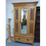 Early 20thC Pine wardrobe with moulded cornice over single bevel mirrored door flanked by carved