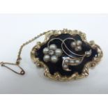 Victorian 9ct gold tested mourning brooch set with a single diamond and pearls as floral decoration,
