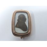 An Georgian 9ct gold (tested) mourning brooch with a silhouette of a gentleman painted on ivory, 2.