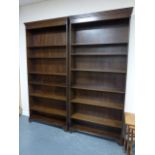 Good pair of oak bookcases with adjustable shelves, each 102x21x216cms.