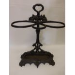 Victorian style cast iron stick stand with lift-out tray, decorated with lions heads, grape & vine.