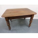 Victorian oak table on turned supports and castors, 106x82.5x69.5cms.
