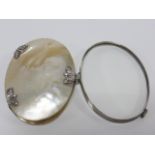 Georgian silver (unmarked) and mother of pearl cased magnifying glass, 8.3x6cms.