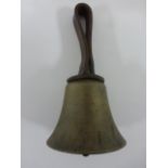 Victorian hand bell with decorated leather handle collar.