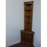 Ercol Golden Dawn corner cabinet with slim plate display shelves over a cupboard base, 60x50x198cms.