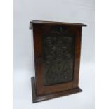 Oak lockable Smoker's cabinet with Art Nouveau copper panel to door, 21x19x28.5cms.