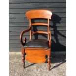 A 19thC mahogany framed commode chair.