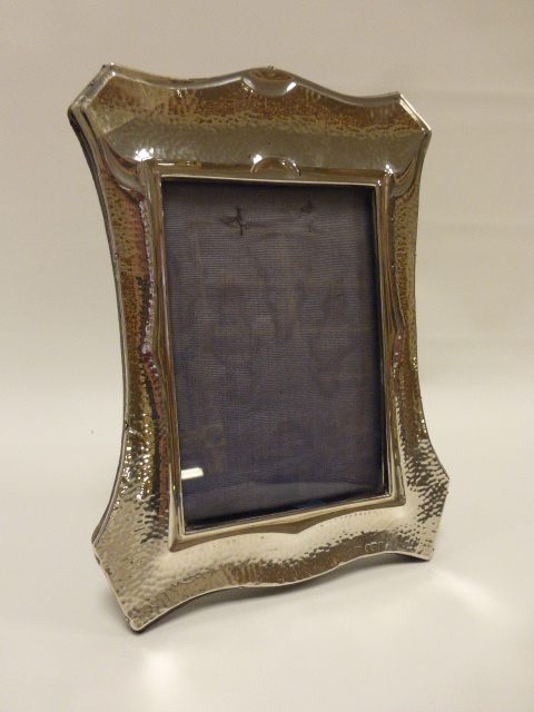 Hammered silver photograph frame hallmarked Birmingham 1906 by makers Deakin & Francis Ltd, 16.