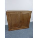 Solid oak twin door cupboard with two internal shelves, on plinth support, 120x51x101cms.