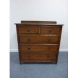 A late 19thC Jas Shoolbred oak chest of drawers, two short over three long graduated drawers,