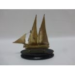 A Maltese 917 silver twin masted sailing ship on an ebonised base, 16cms total height.