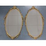 Pair of gilt framed mirrors, each 39.5x66cms.